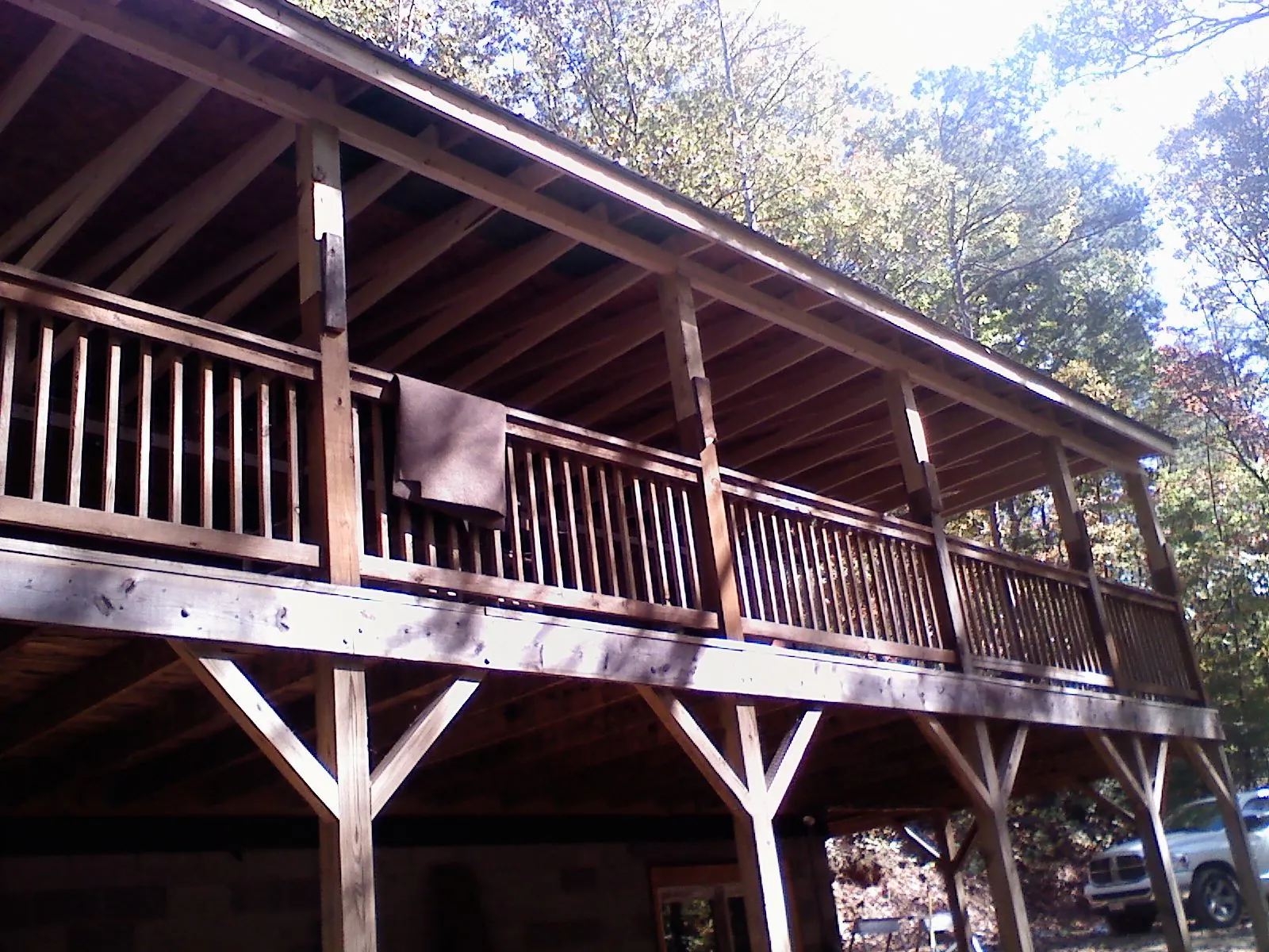 Timber framing under a new elevated porch and deck — Roof Leak Repair in Brazil by Roofing Brothers